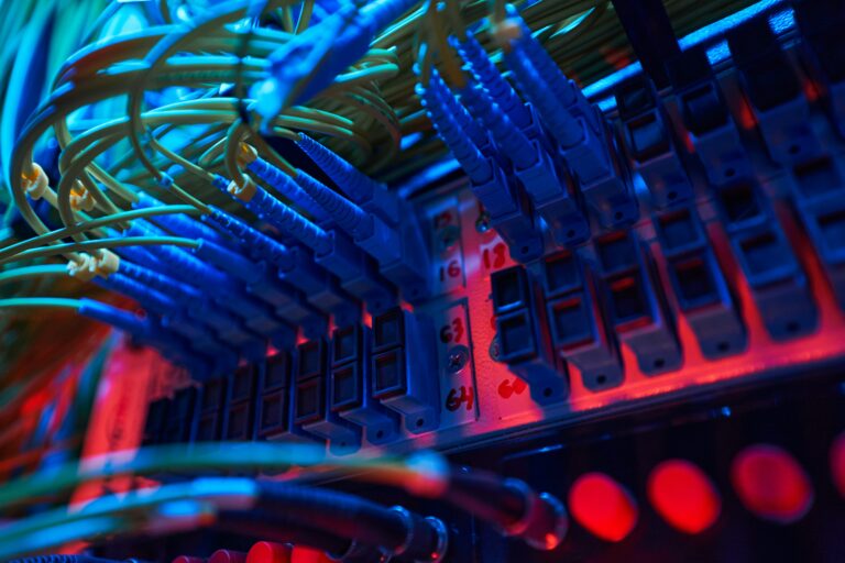 IT professional performing routine server maintenance in a modern data center to improve system reliability and business performance.