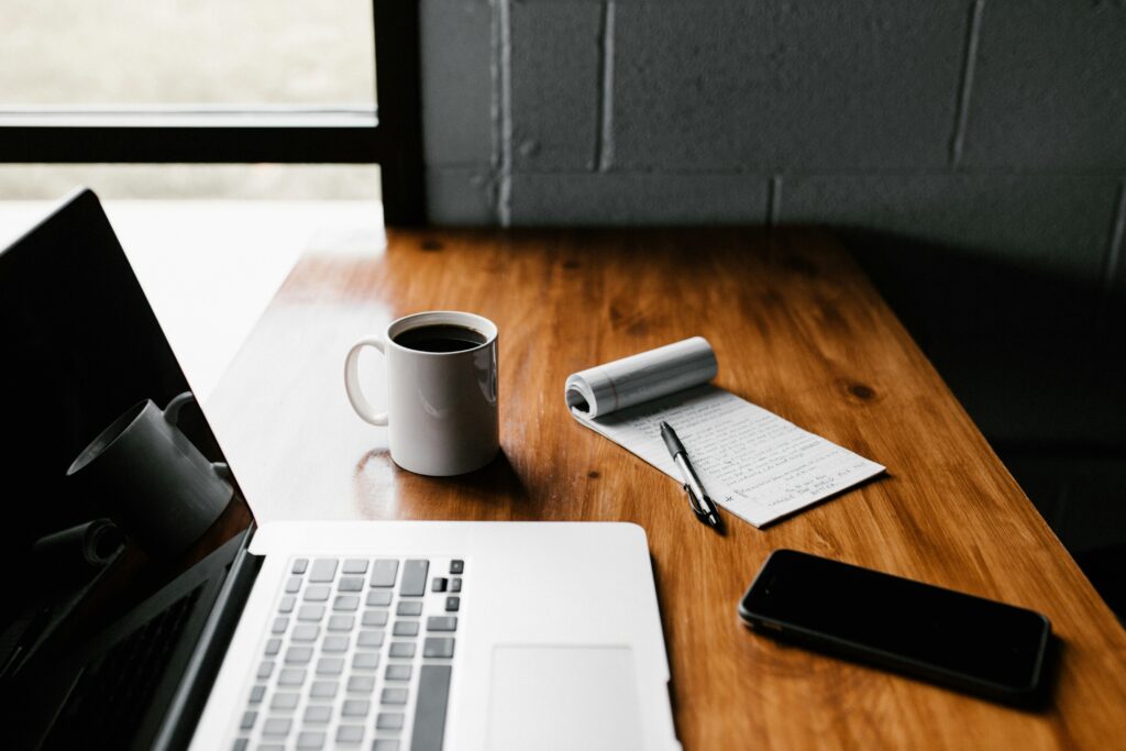 Business owner reviewing an IT health report on a laptop — EvolvingDesk IT Check