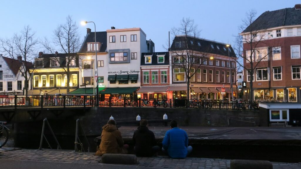 IT support Groningen: people by the water in Groningen city centre